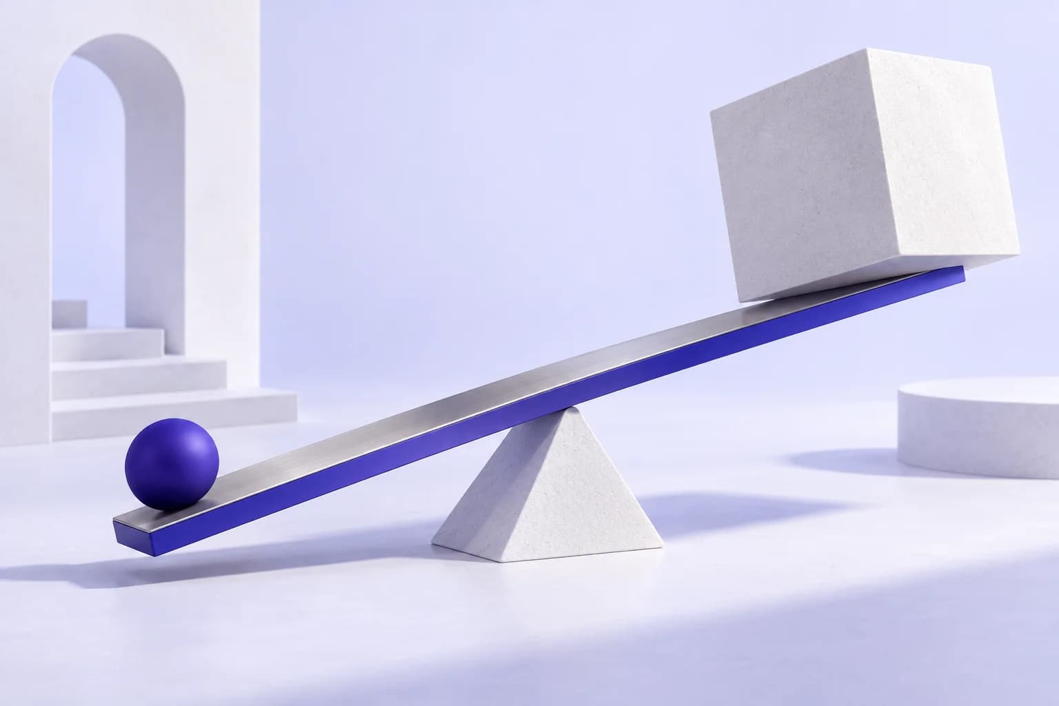 An indigo sphere and a large white cube balanced on a sculptural lever